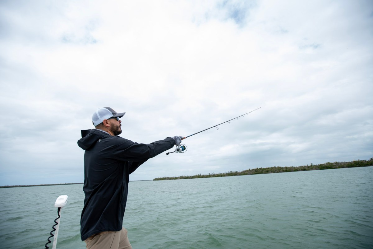 An angler casting a fishing rod.