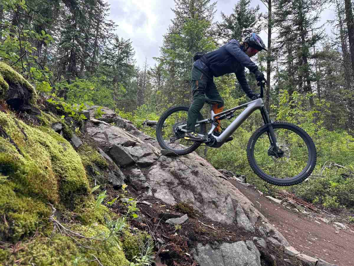 Athlete Dane Tudor wheelie-dropping the Levo 4 EVO Pro e-mountain bike; (photo/Morgan Tilton)