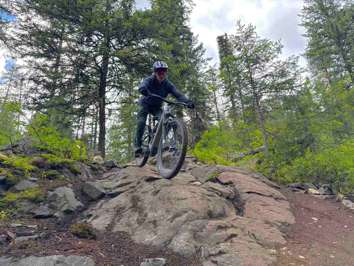Athlete Dane Tudor riding a rock roll with the Levo 4 EVO Pro e-mountain bike; (photo/Morgan Tilton)