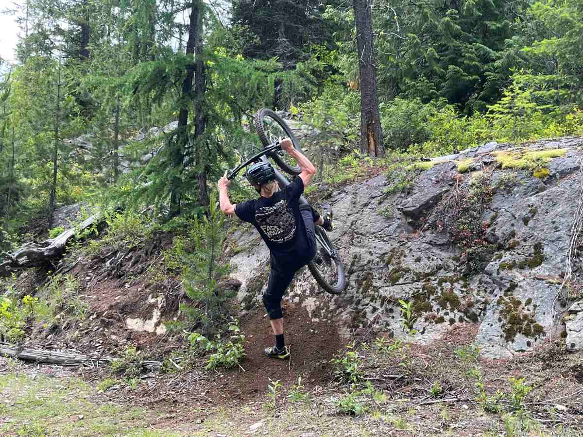 Athlete Dane Tudor foot-planting with the Levo 4 EVO Pro e-mountain bike; (photo/Morgan Tilton)
