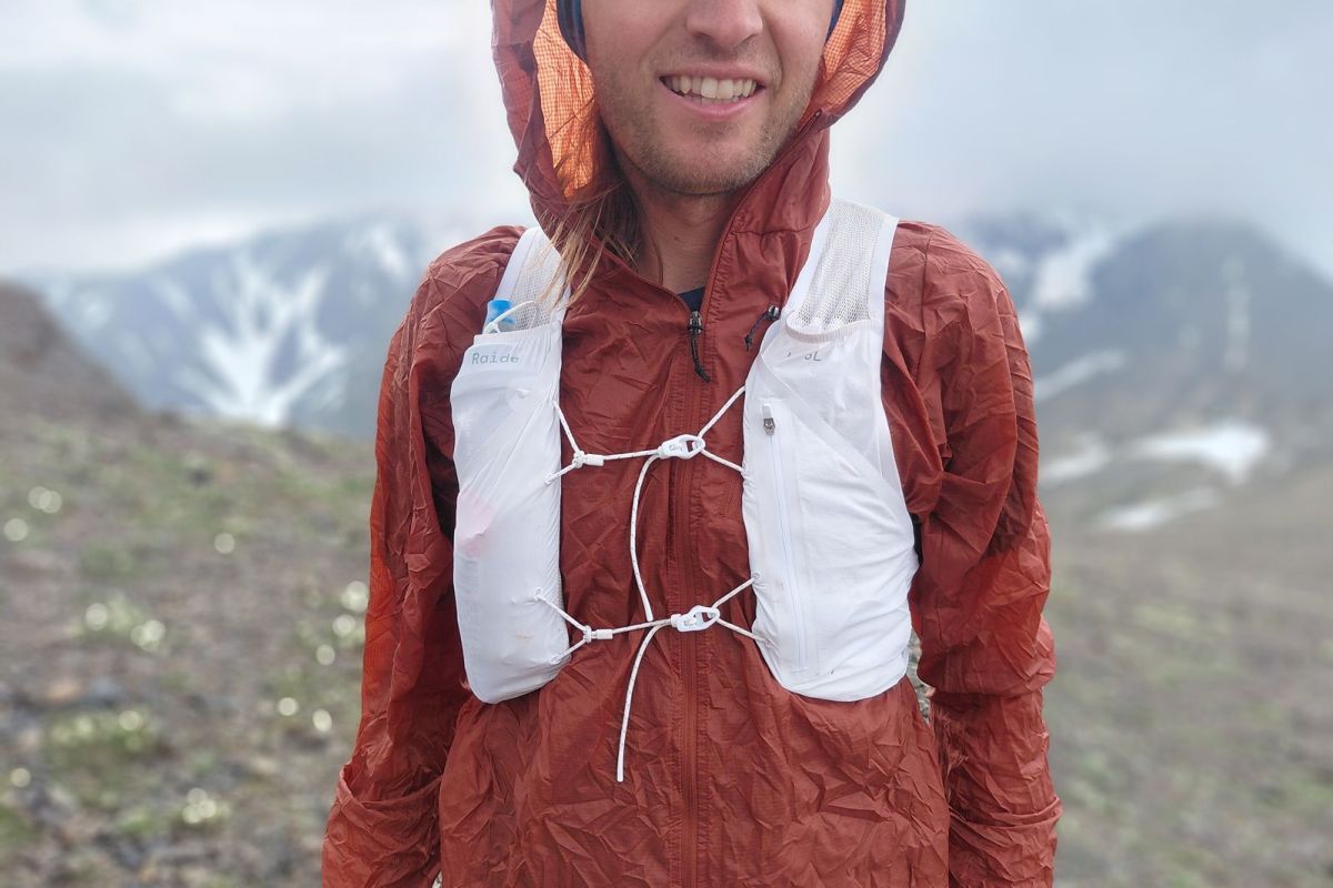Front view of the white LF 5L Running Vest with chest pockets and adjustable cords