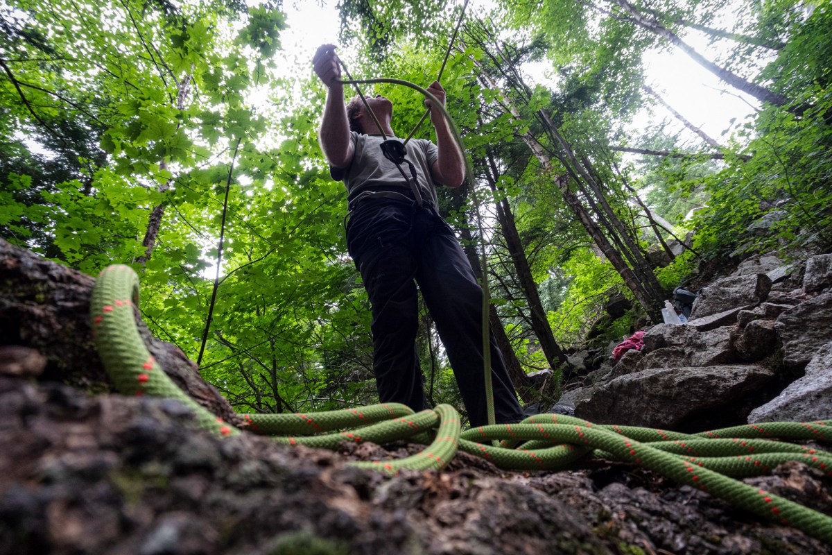 Belayer managing the Mammut Crag Recycled 9.8mm rope at the base of a climb