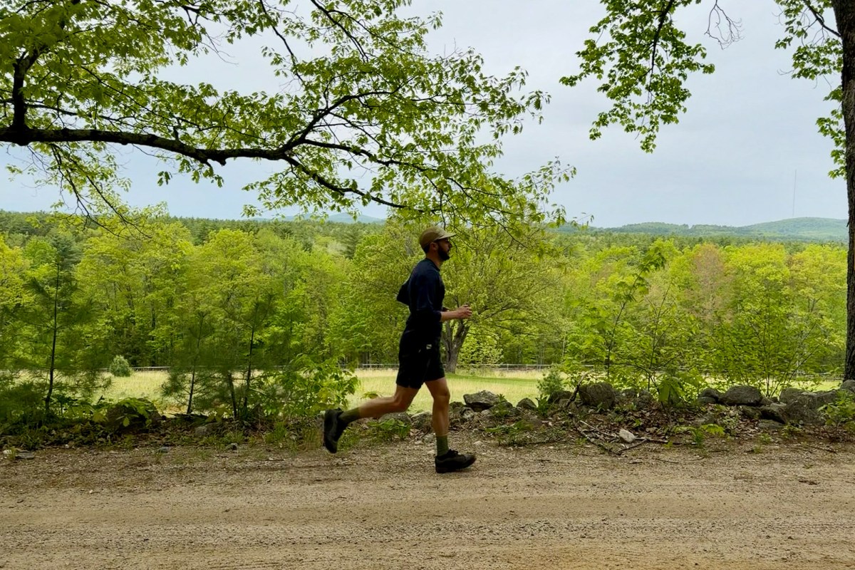 Runner wearing Trail Daemon shorts on a gravel path