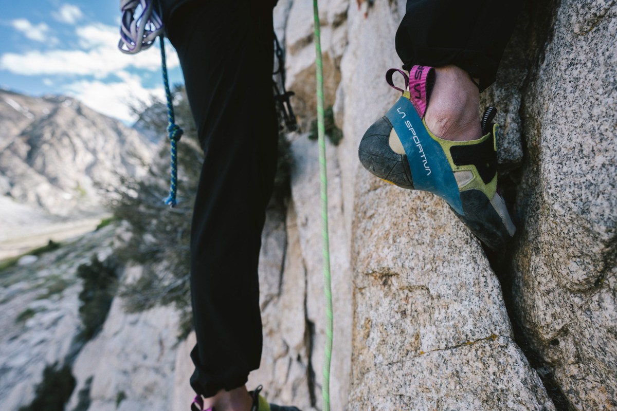 Close-up of a Skwama shoe edging on a granite wall during a climb