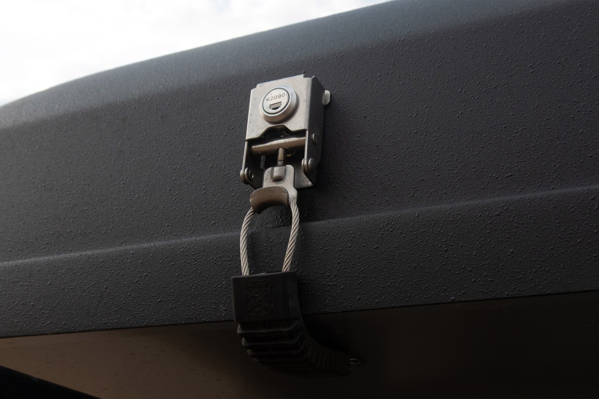 Close-up of the lock securing the iKamper hard-shell rooftop tent