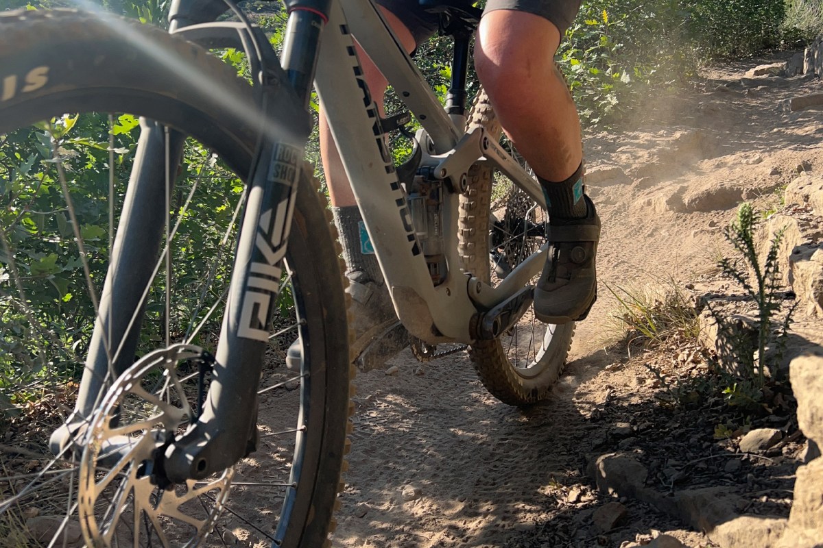 Crankbrothers flat MTB shoe on the pedal while climbing a rocky trail