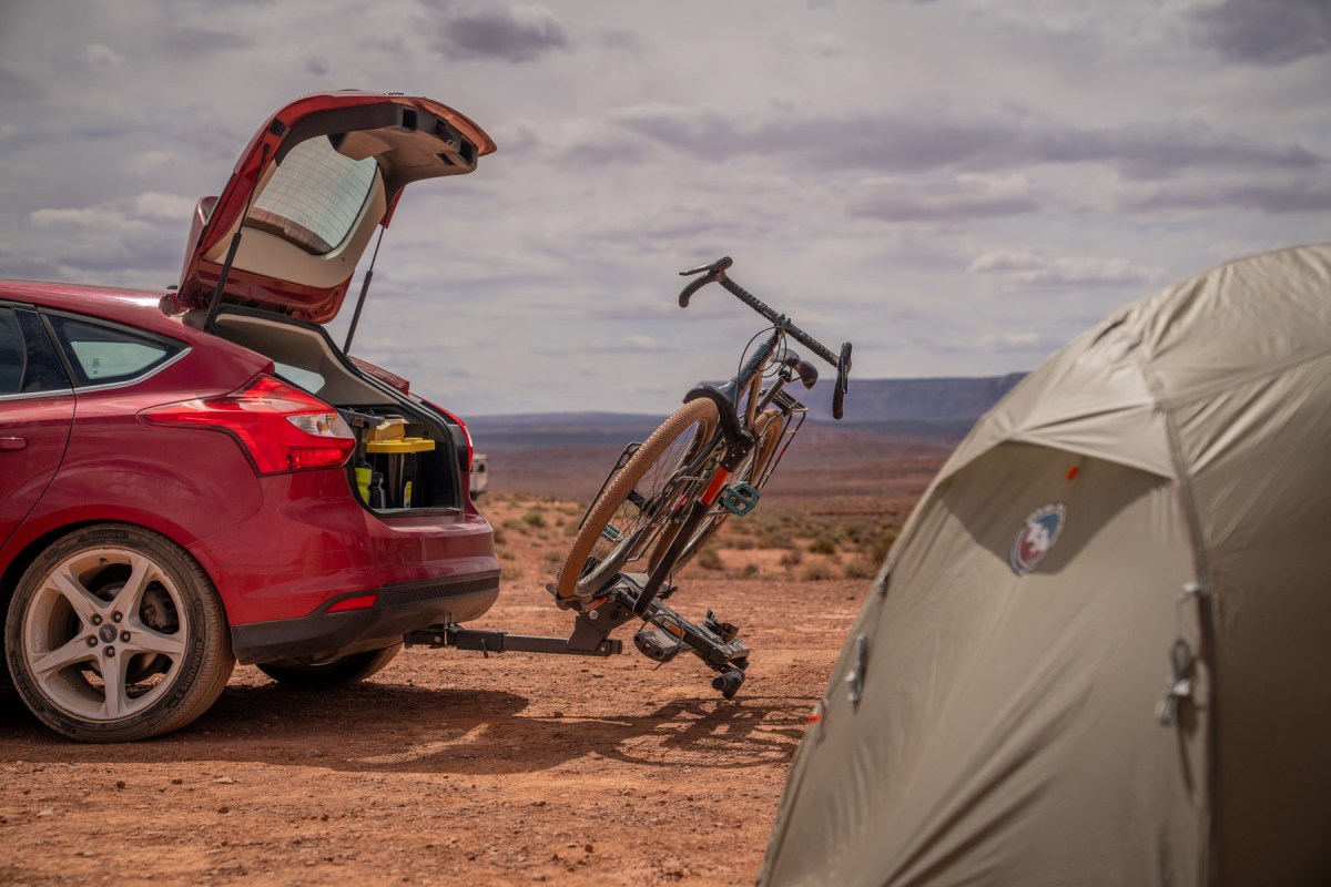 Kuat NV 2.0 2-Bike Hitch Rack tilted down beside a desert campsite