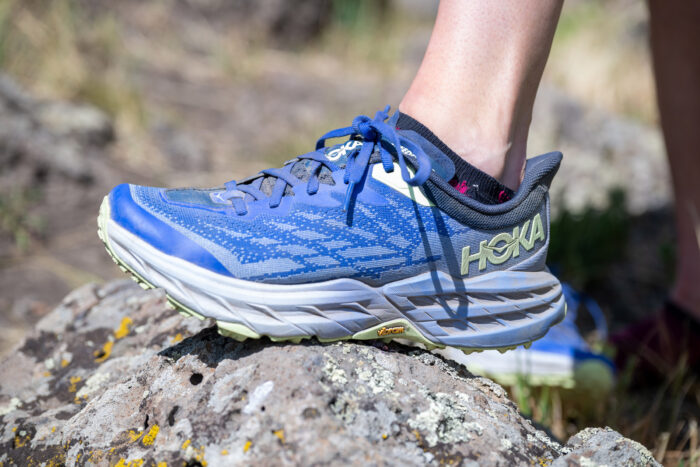 A close up view of a trail running shoe