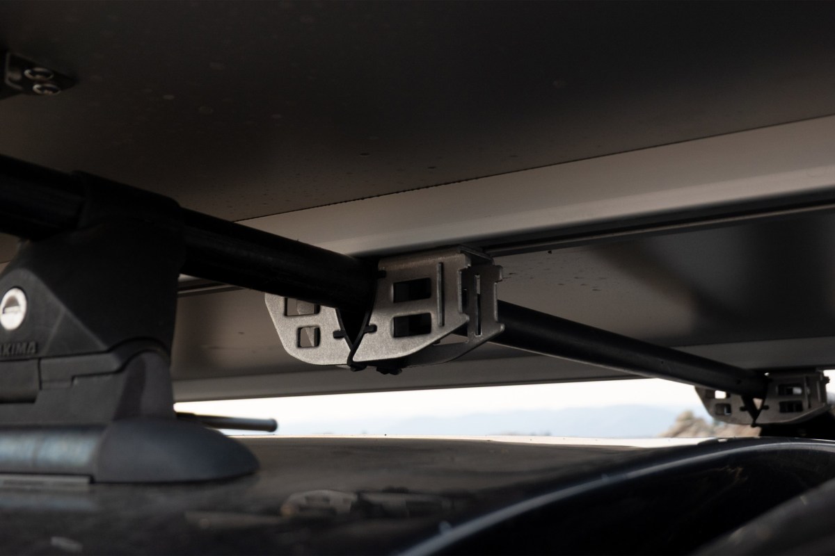 Close-up of the Skycamp mounting brackets attached to roof crossbars