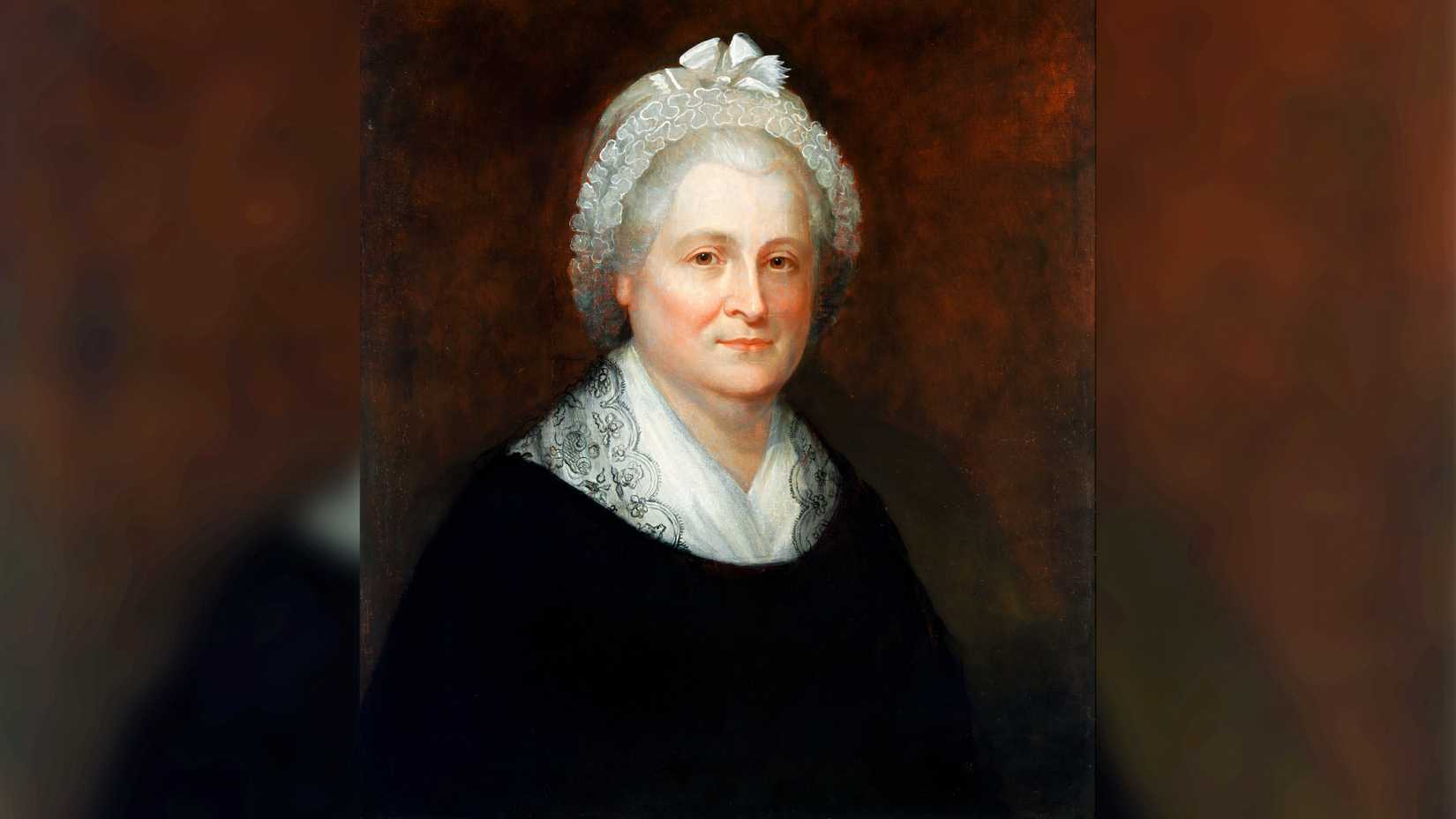 A Rembrandt Peale portrait shows Martha Washington wearing a white lace cap and dark clothing.