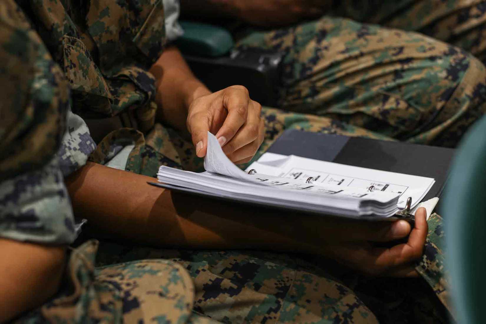 Marine recruits receive a class on rank structure