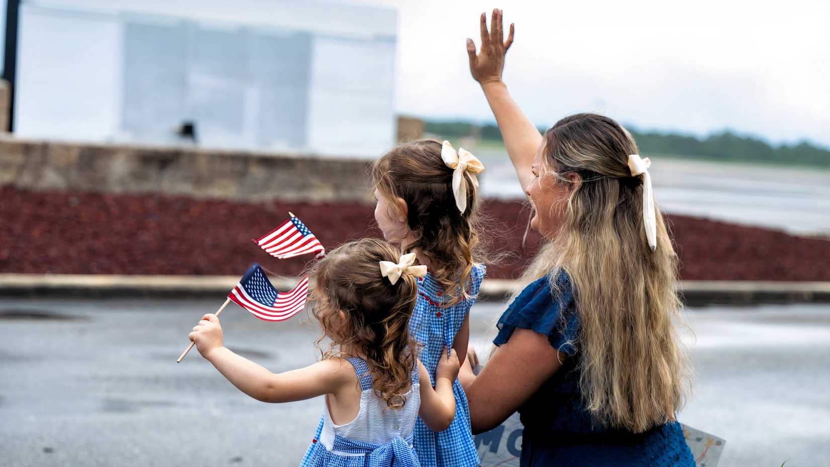 Mom and daughter with flags