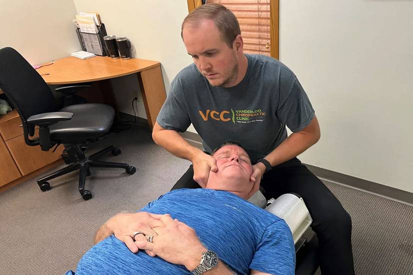 John-Paul Sager, a veteran of the Marine Corps and Army, is treated for chronic back and shoulder pain by chiropractor
