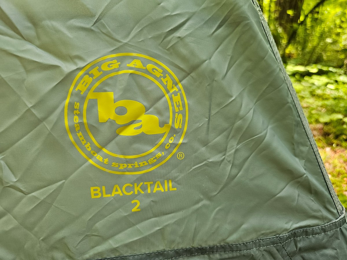 a close up of the big agnes logo on the rainfly of the tent