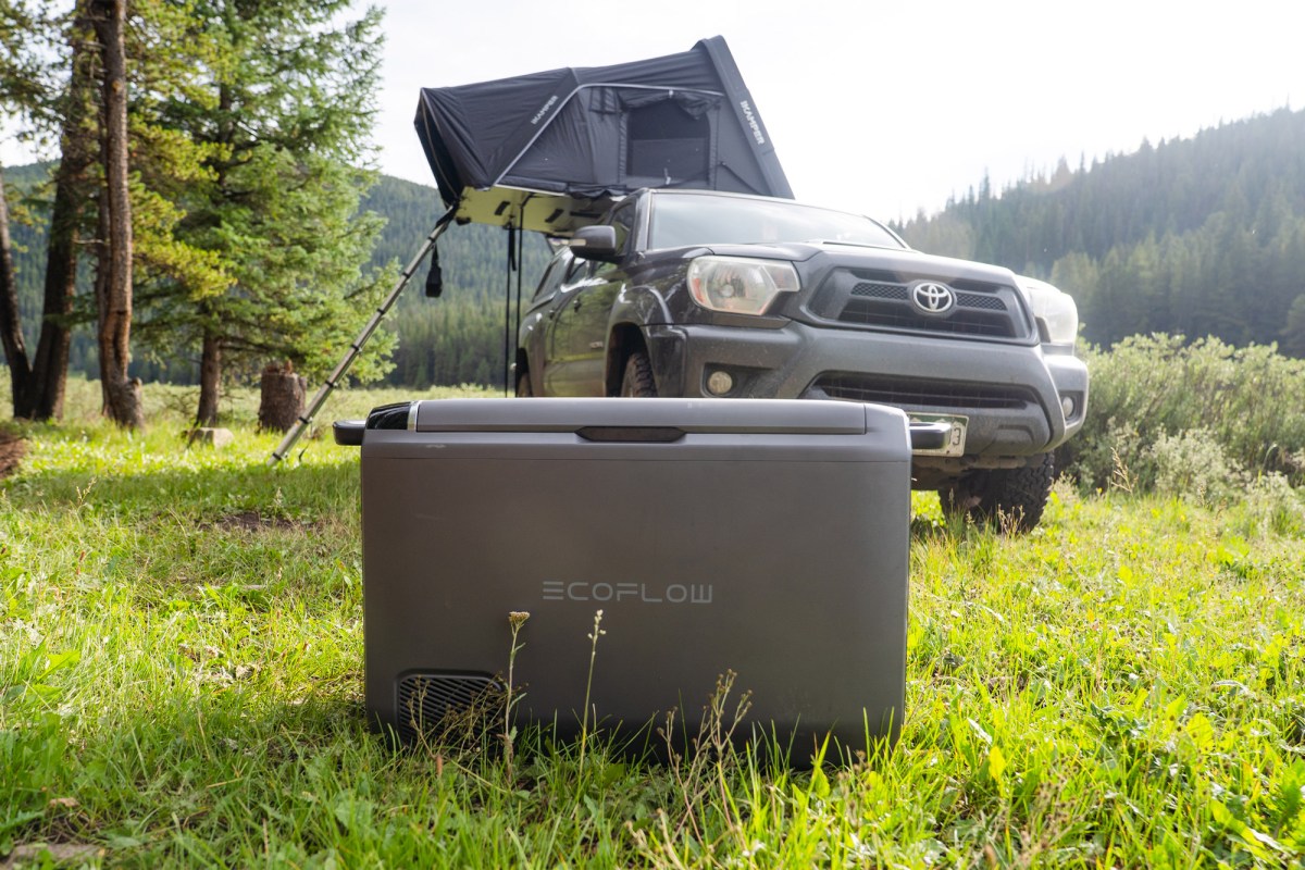 EcoFlow GLACIER Classic 45L portable fridge beside a truck and rooftop tent