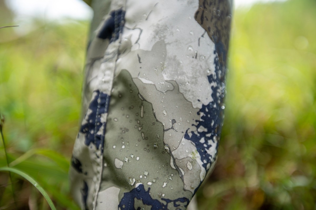 Water beading up on a camo pant leg.