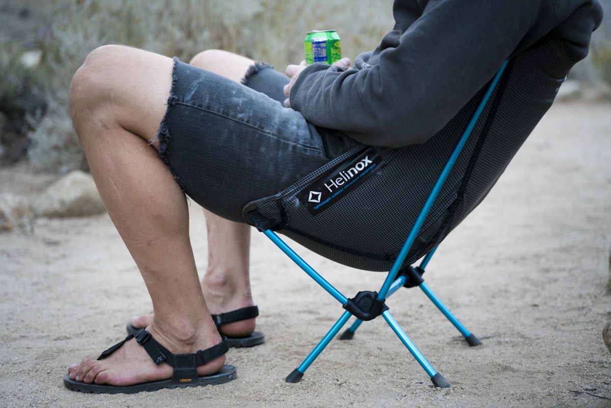 gearjunkie tester sitting in the helinox ground chair in southern california