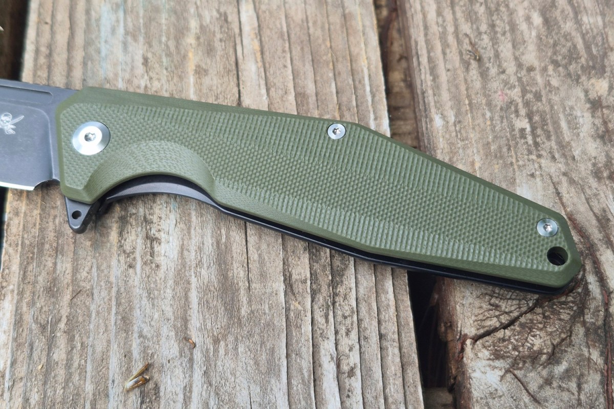 Close-up of the textured green handle and hardware on the Skallywag knife