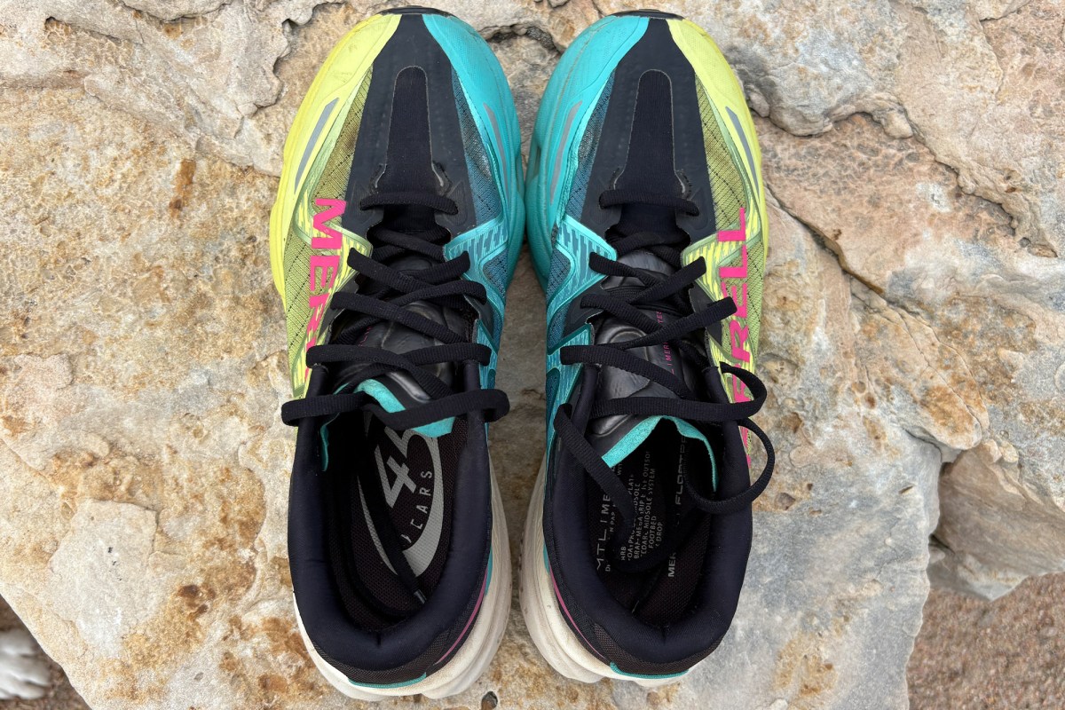 Top view of colorful trail running shoes on a rock