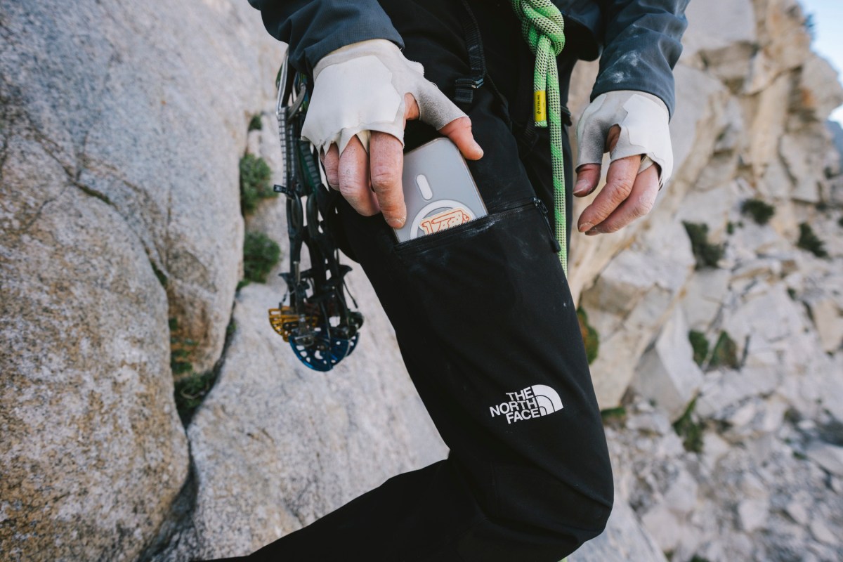 Zippered thigh pocket on The North Face climbing pants holding a phone