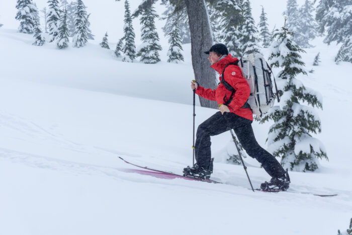 a gearjunkie tester skins up the slope wearing the TNF Torre Egger