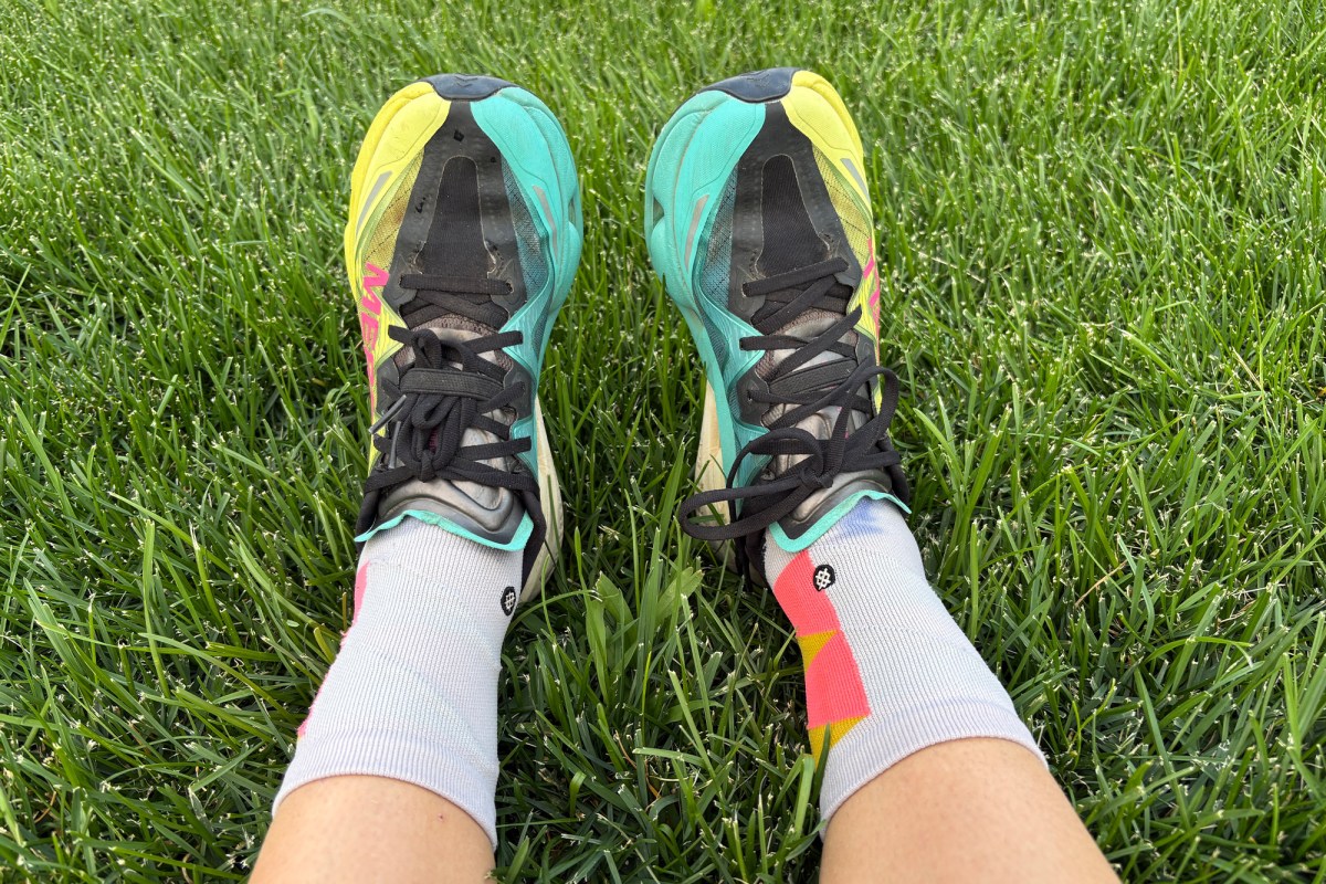 Top view of SpeedArc Peak shoes resting on green grass