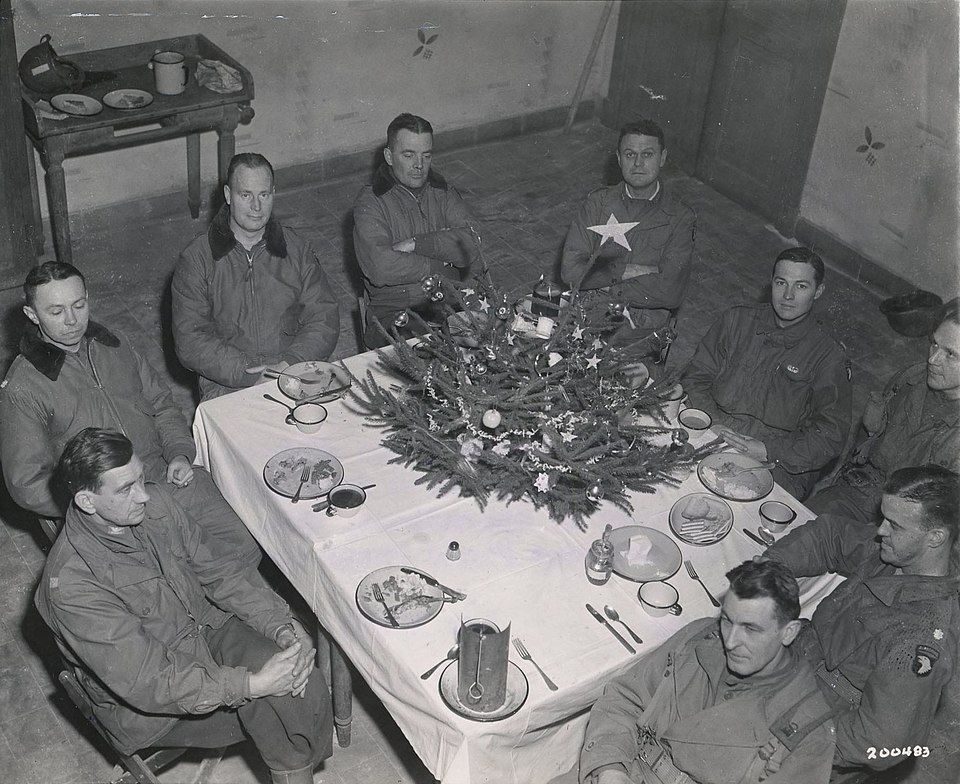 brig._gen._anthony_mcauliffe_and_his_staff_gathered_inside_bastognes_heintz_barracks_for_christmas_dinner_dec._25th_1944.jpg