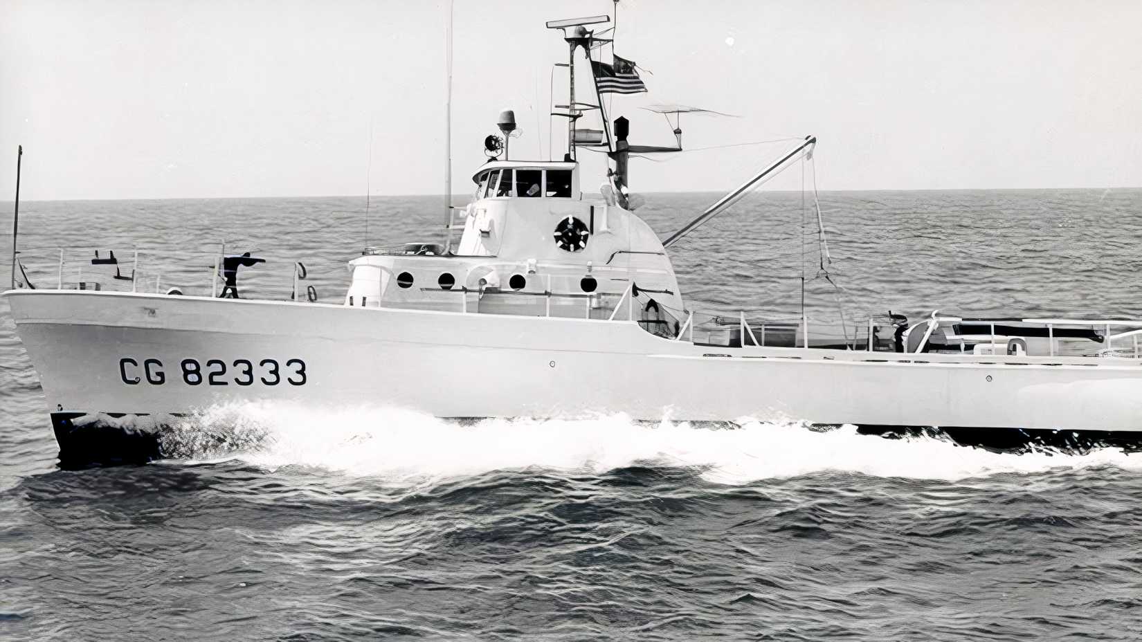 The 82-foot Coast Guard cutter Point Highland speeds through open water off Crisfield, Maryland, in 1965.