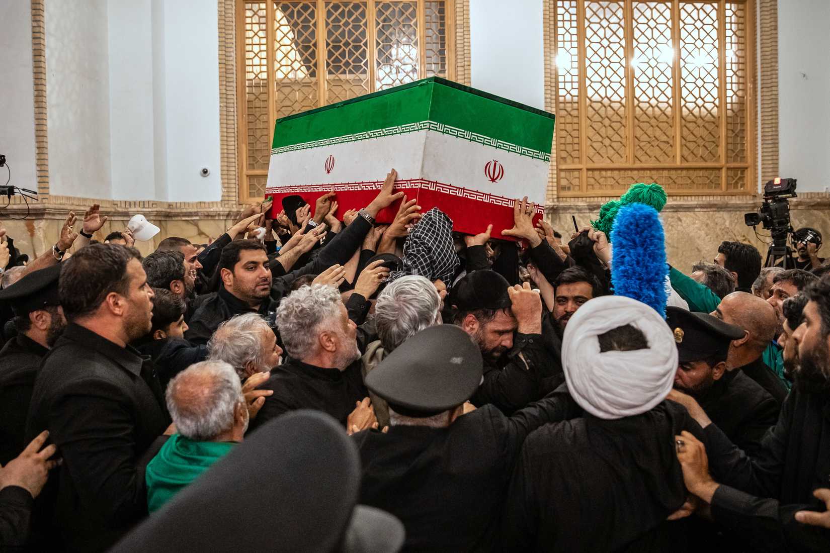 Mourners carry the coffin of the late Iranian Supreme Leader Ayatollah Ali Khamenei 
