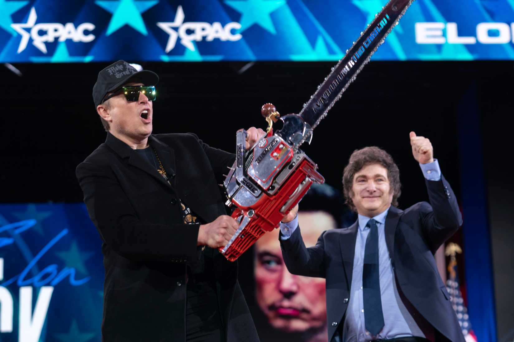 Elon Musk receives a chainsaw from Argentina's President Javier Milei at CPAC